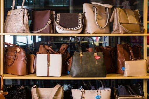 Shelf in a bag store with luxury handbags